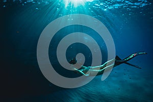 A girl dives in apnea in Mediterranean sea