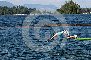 Girl diving into lake