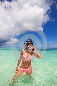 Girl in the diving mask at the beach