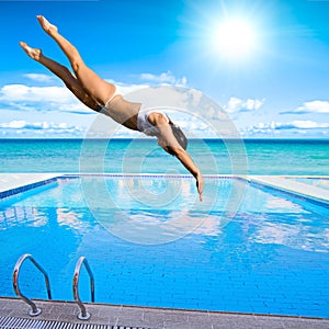 Girl diving into pool