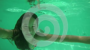 Girl diving in swimming pool