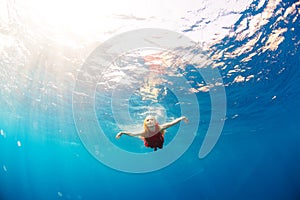 Girl diving under the sea