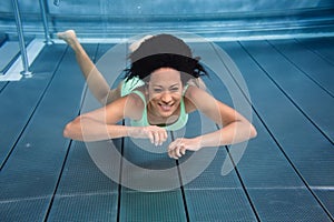 Girl diving underwater in swimming pool