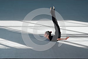 Girl do backfold rhythmic gymnastics