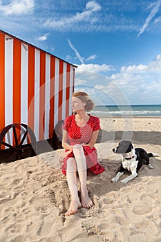 Girl dog beach cabin sea, De Panne, Belgium