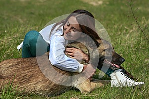 Girl And a Dog Hugs