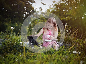 Girl with dog reading a book