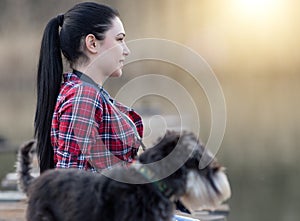 Girl with dog on wooden dock