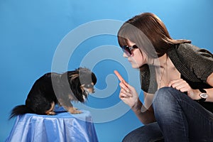 The girl with the doggie on a blue background