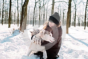Girl with dogs in winter park