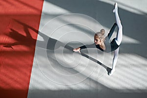 Girl doing the balance in hall rhythmic gymnastics