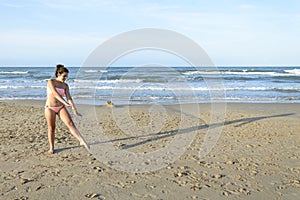 Girl doing cartwheel on the beach