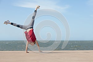 Girl doing cartwheel photo