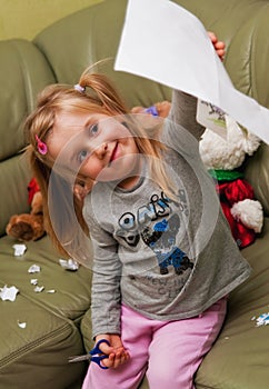 Girl doing cutouts at home