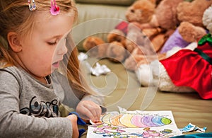 Girl doing cutouts at home