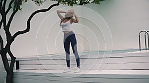 girl doing exercises in the backyard