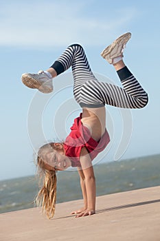 Girl doing handstand photo