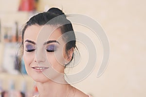 Girl doing make-up in a beauty salon. Toning