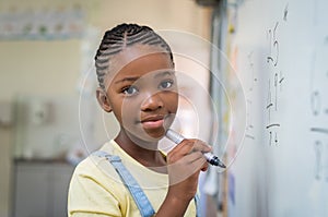 Girl doing math at whiteboard