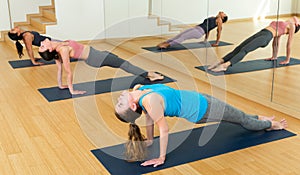 Girl doing Purvottanasana or Upward Plank pose during yoga workout