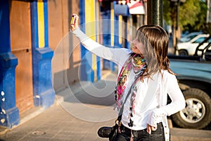 Girl doing an urban self portrait