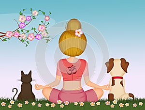 Girl doing yoga with her domestic animals in spring