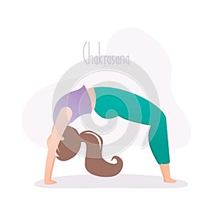 Girl doing yoga pose, wheel pose or chakrasana asana in hatha yoga