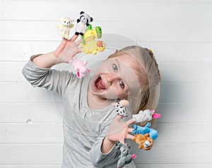 Girl with doll puppets on her hands