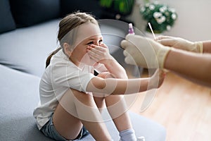 Girl don`t want to make testing at home showing COVID-19 virus