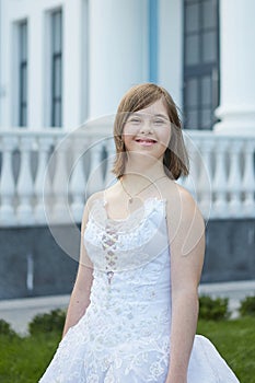 Girl with Down syndrome in  wedding dress