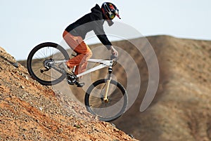 Girl downhill on bike