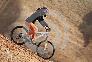 Girl downhill on mountain bike