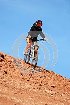 Girl downhill on mountain bike