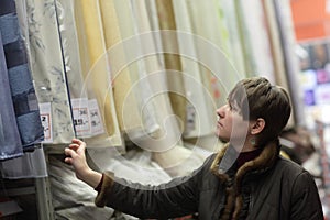 Girl in drapery shop