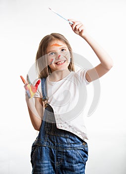 Girl drawing in the air with paintbrush over white background