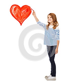 Girl drawing big red heart in the air