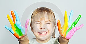 Girl drawing. Funny child girl art school student with colorful painted hands on white background