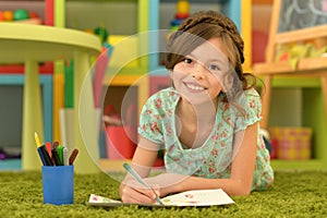 girl drawing at home