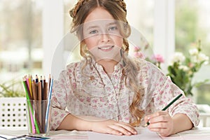 girl drawing at home