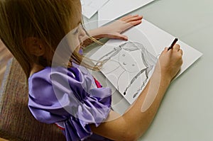 Girl drawing with pencil