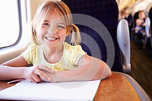 Girl Drawing Picture On Train Journey