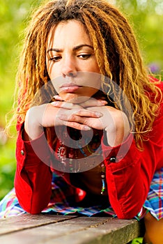 Girl with dreadlocks longs