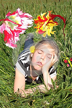 Girl dreaming in a flower garden