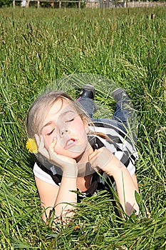 Girl dreaming on a meadow