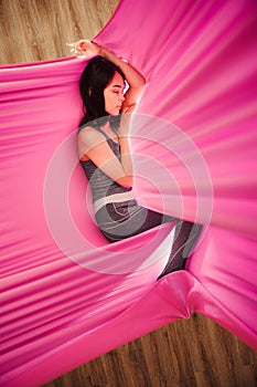 Girl dreaming and meditation in hammock hanging in relaxed position