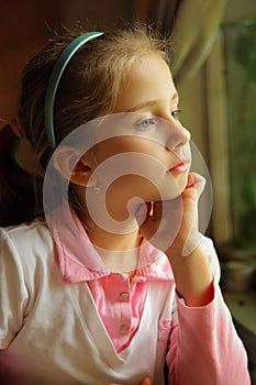 The girl dreaming at a window