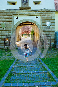 Girl in dress and hat going to Ecaterina Gate