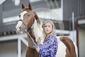 Girl in dress with horse