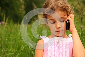 Girl in dress talking on cell phone