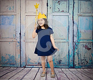 Girl Dressed as a Princes holding a magic wand